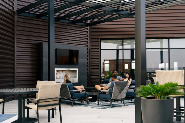 rooftop lounge with fireplace at the oxbow homes for rent in north kansas city